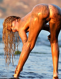  Mira A Presenting Mira Lengthy haired golden-haired receives down and dirty in the sand in the mud and sun.