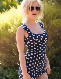 Catie Parker pulls down her polka dot dress below the glowing sun - Digital Desire