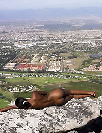 Naomi High on top of a South African mountain side, Naomi receives in nature's garb showing off a new kind of freedom
