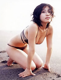 Hiroko Sato Erotic oriental beauty laying around on the beach in her bikini